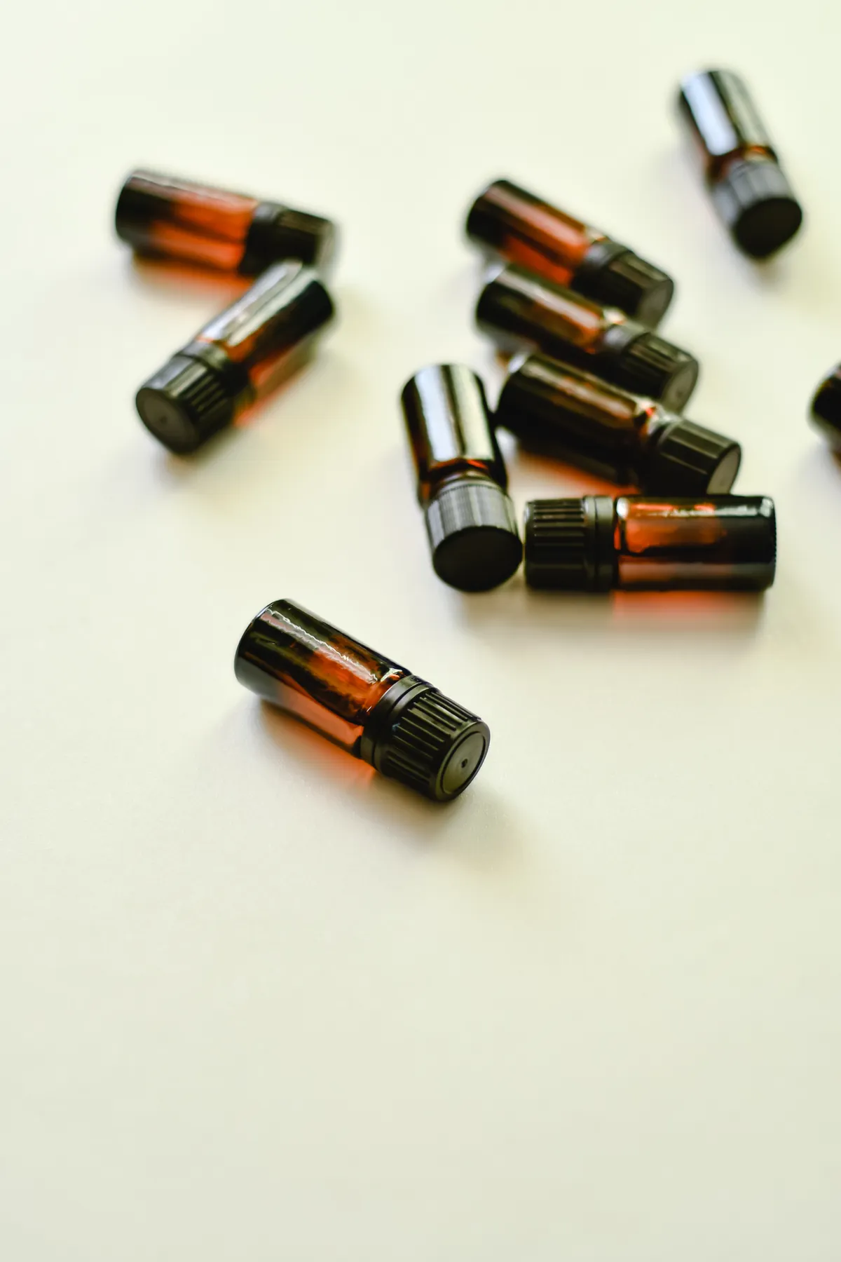 Small essential oil bottles on a white surface, illustrating the search for the best essential oil brands that are pure